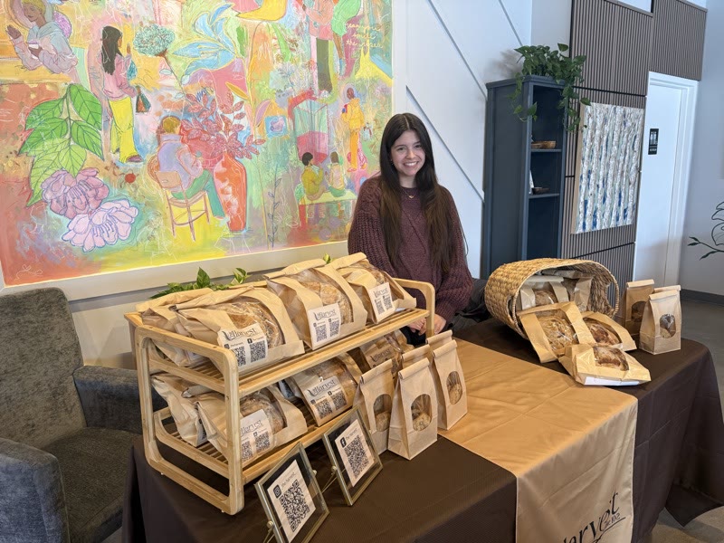 Alanna, the baker behind The Harvest, at her farmers market stand