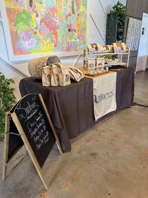 The Harvest table set up at an indoor market